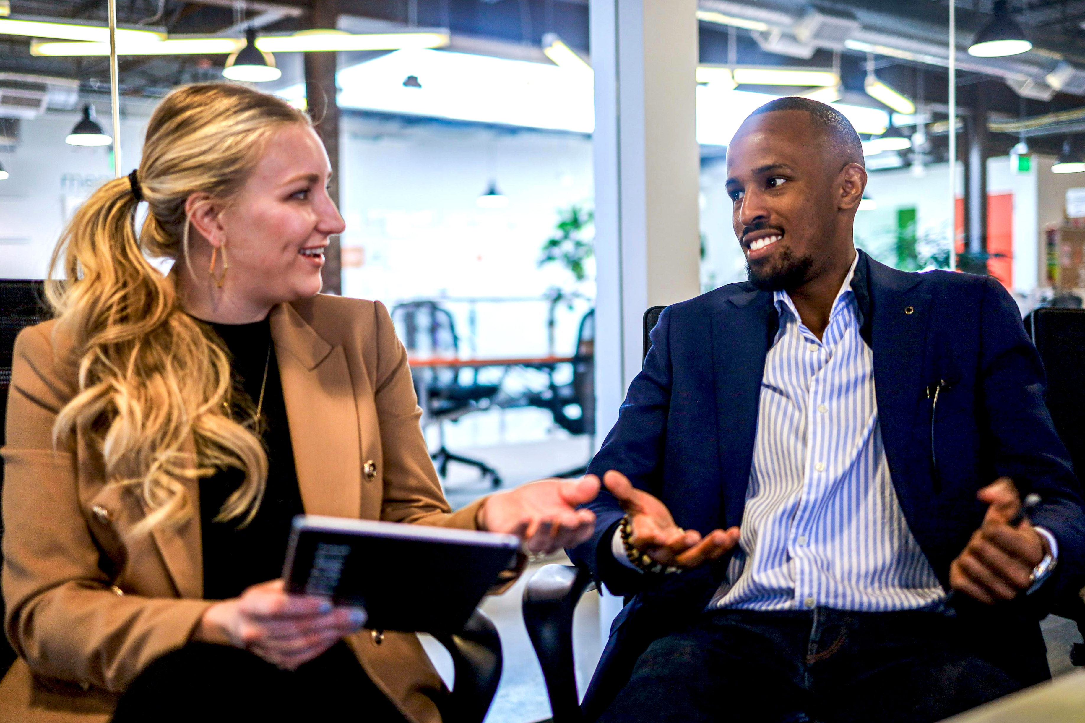 A woman and a man having a conversation.