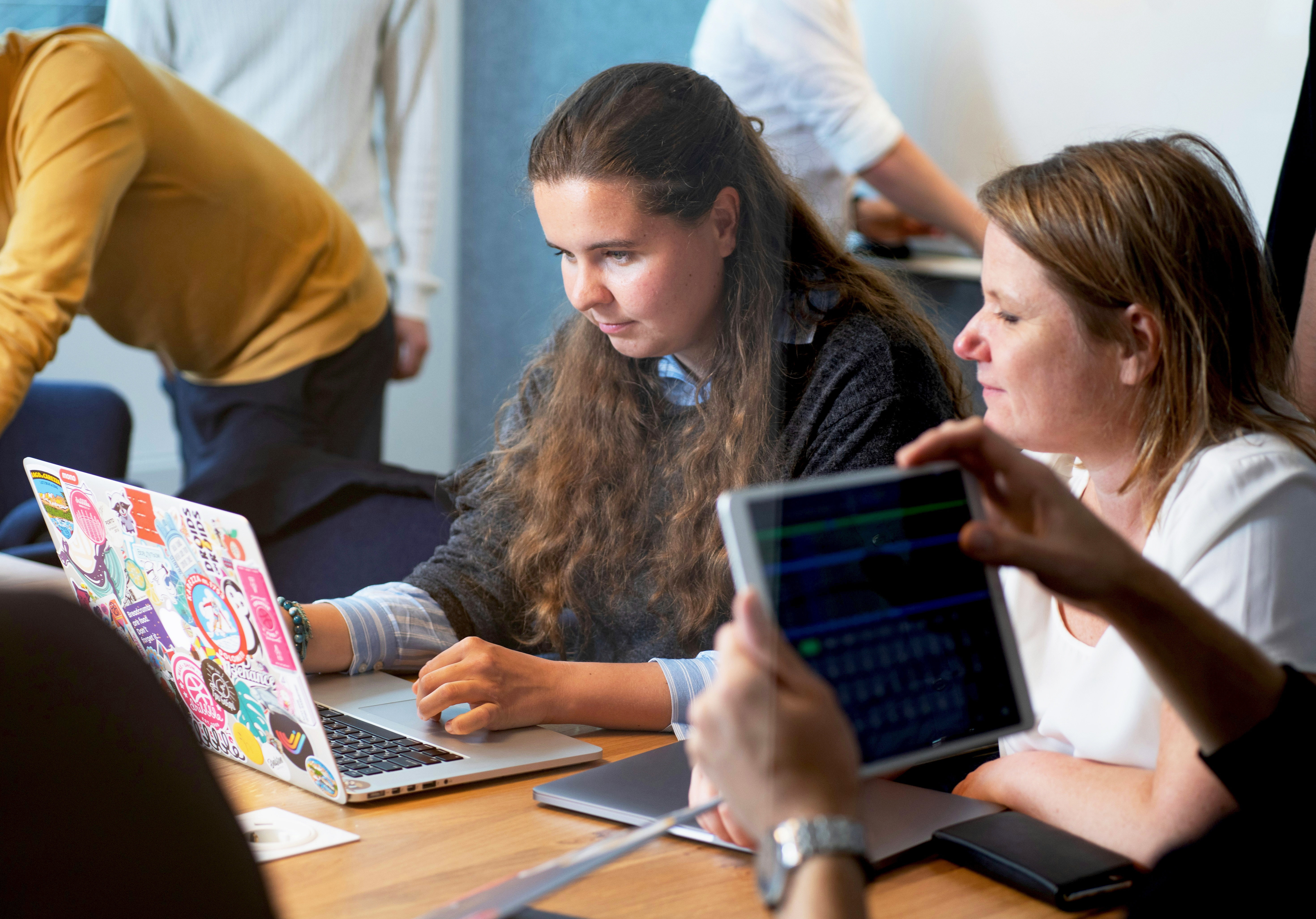 Students looking at a laptop screen.