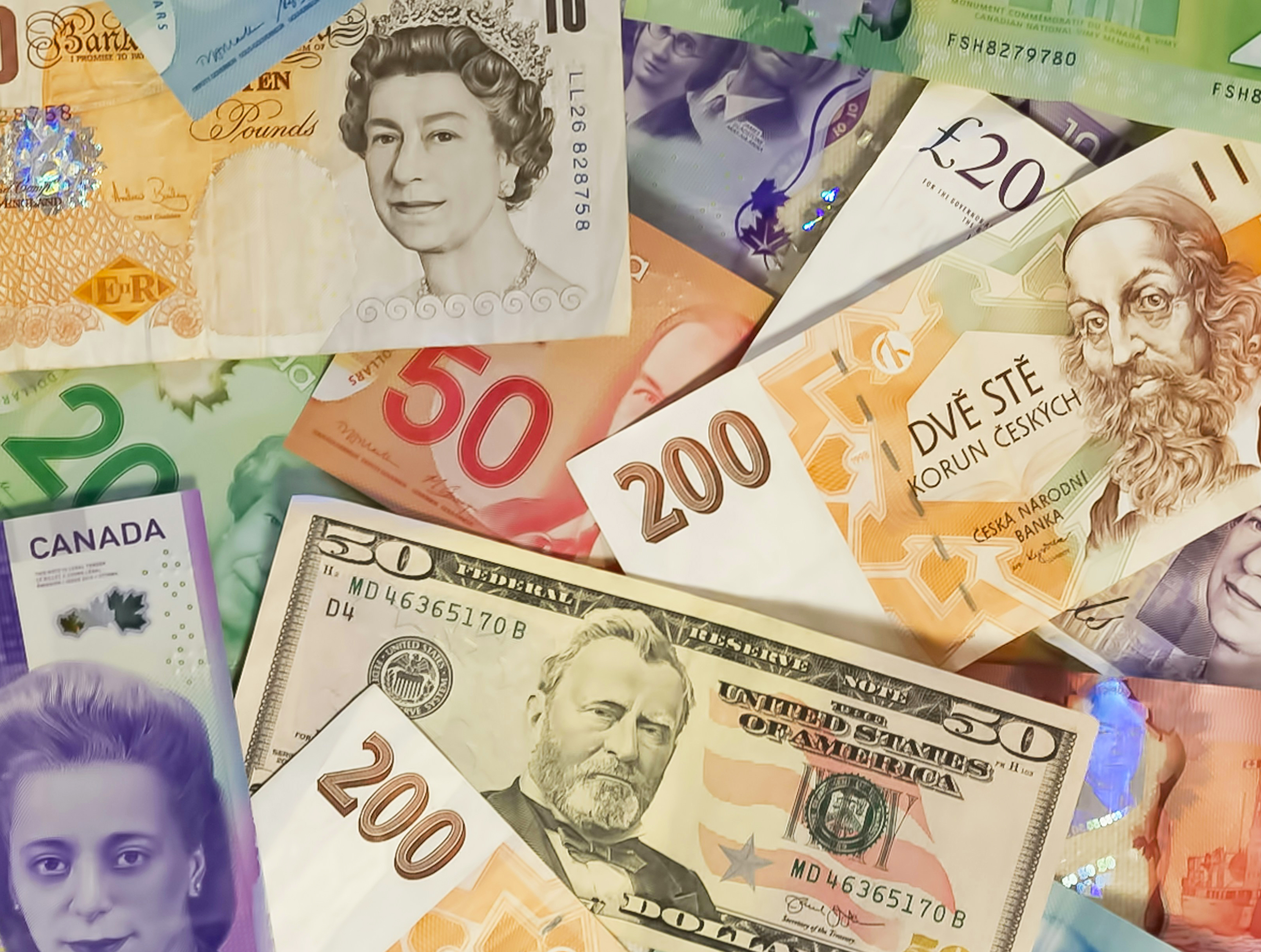 Banknotes from different countries displayed together.