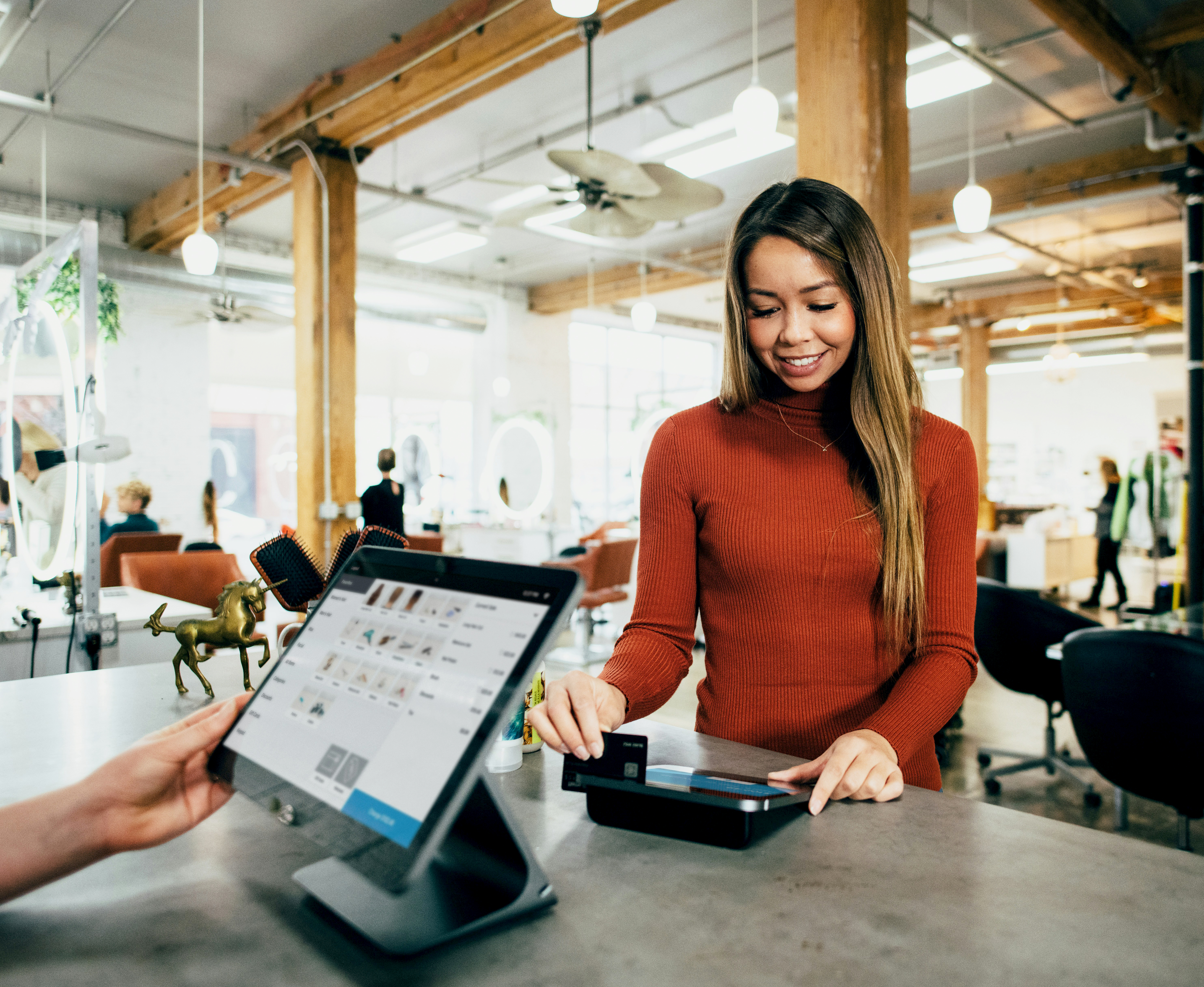 Woman paying with her credit card.
